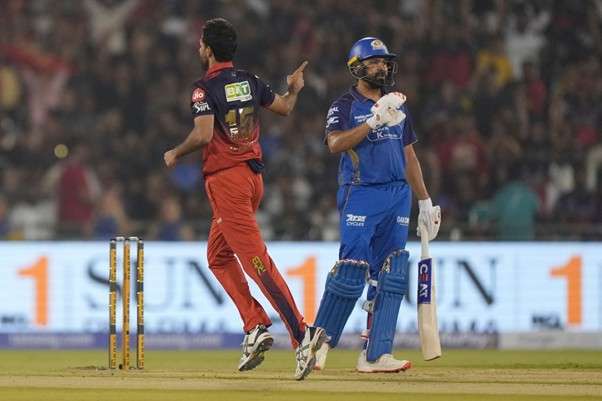 Bhuvneshwar Kumar & Rohit Sharma. Pic Credits: AP